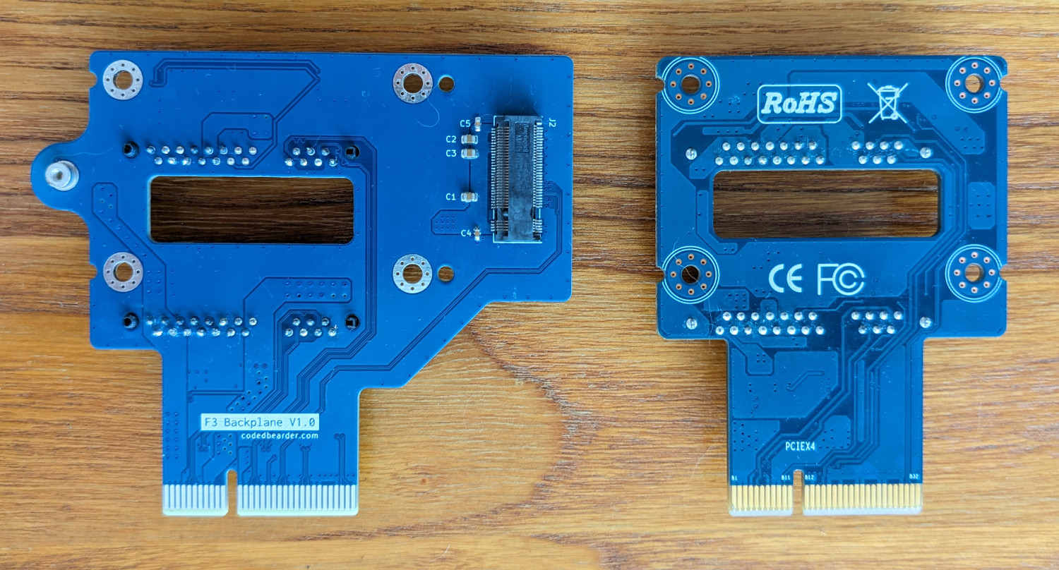 Picture of the front of the new backplane PCB next to the original one.